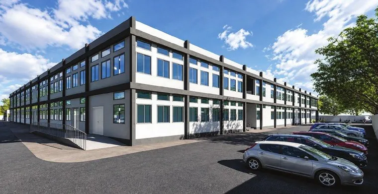 Two-storey hospital building with continuous ribbon windows and parking in front