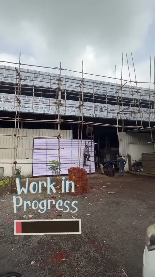Corporate office façade under construction at Makarpura GIDC with scaffolding