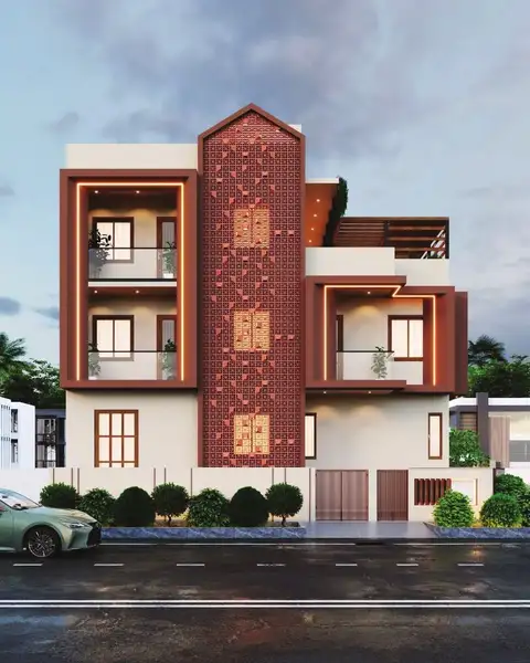 Three-storey residence with a terracotta brick jaali tower and white balconies