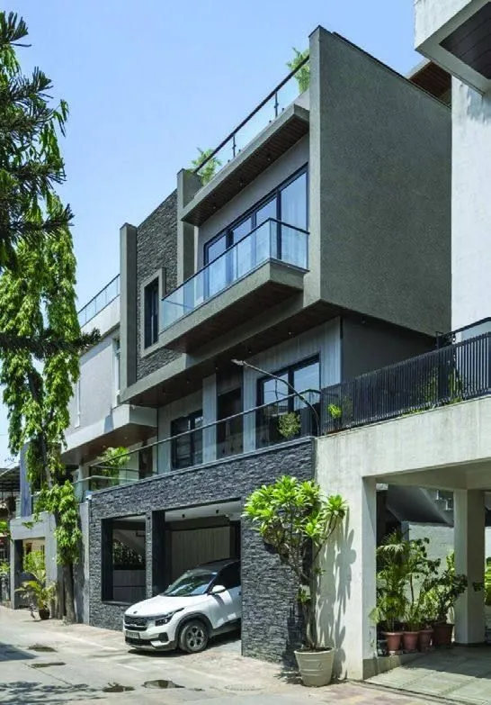 Grey stone and glass residence on a corner plot