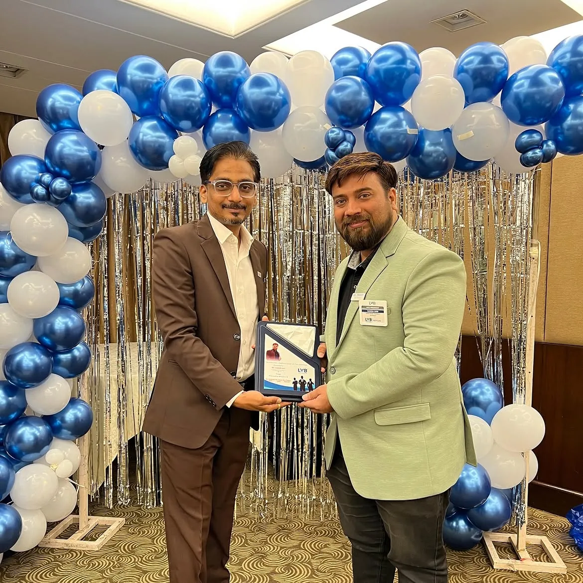 Ar. Ganesh Soni receiving an award from LVB Neptune Vadodara